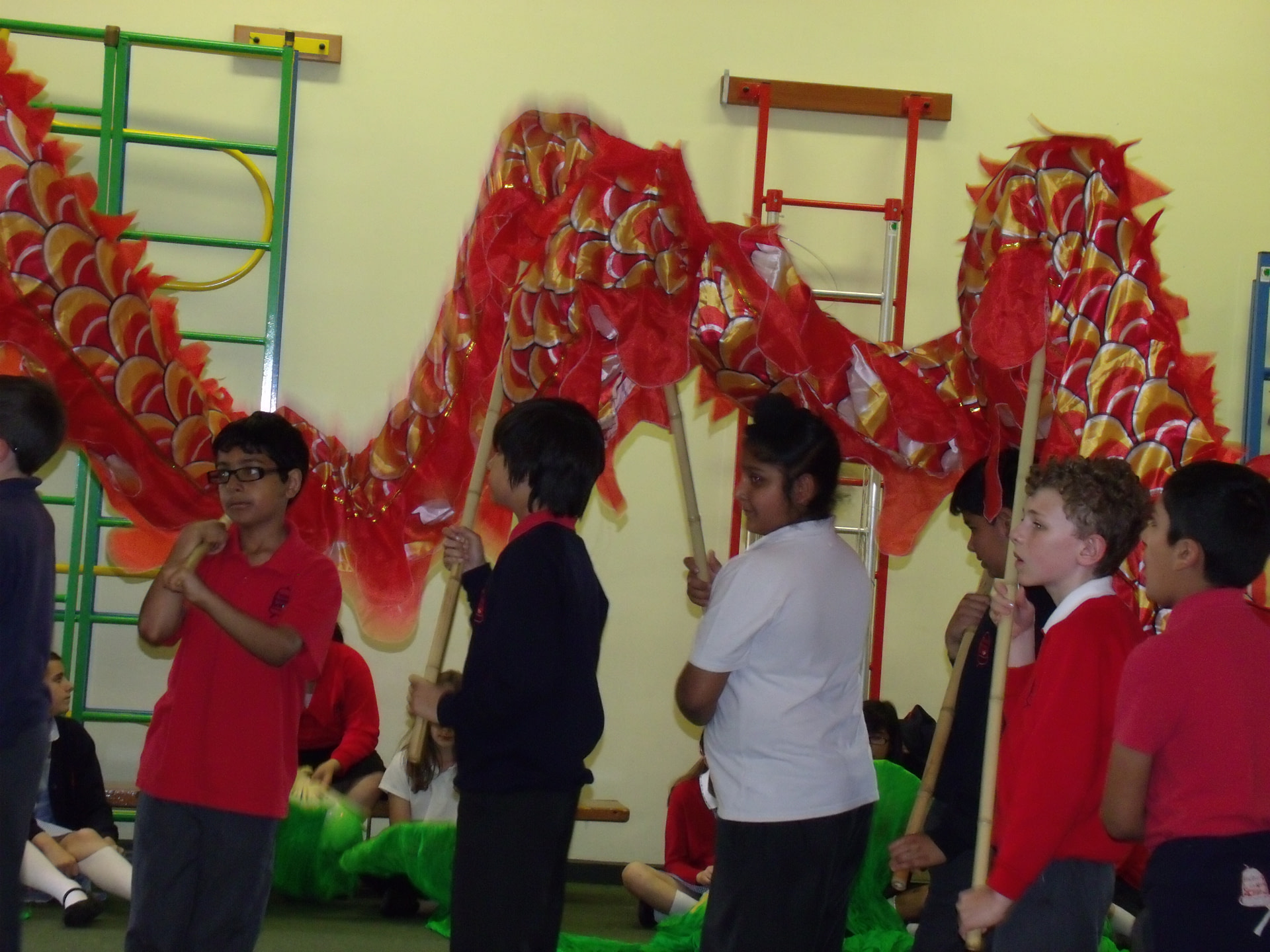School children holding chinese dragon