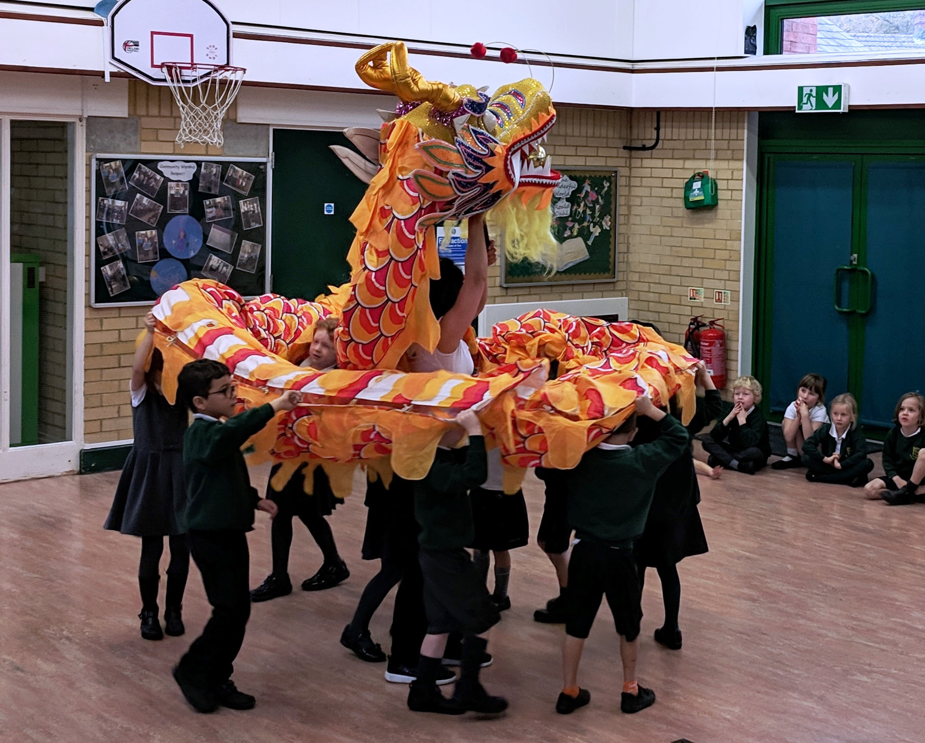 Chinese dragon dancing in school hall
