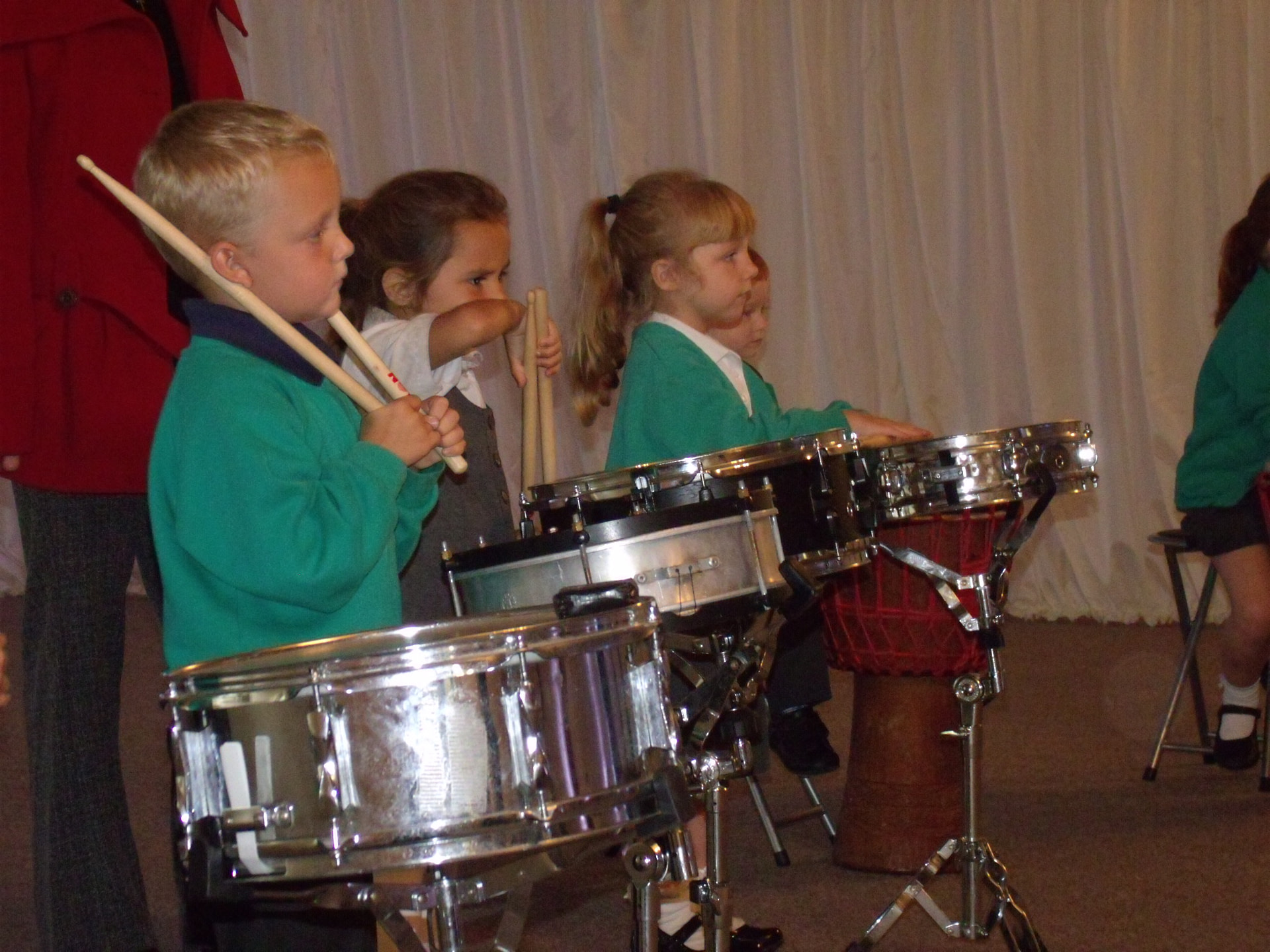 School children playing samba drums