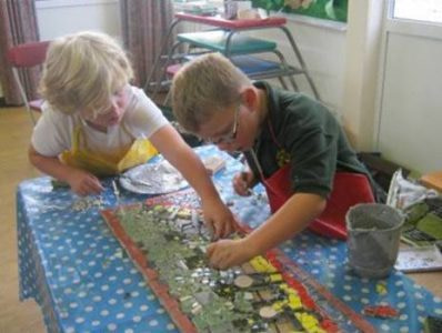 School children creating a mosaic